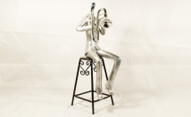 give this man holding saxophone showpiece on rent